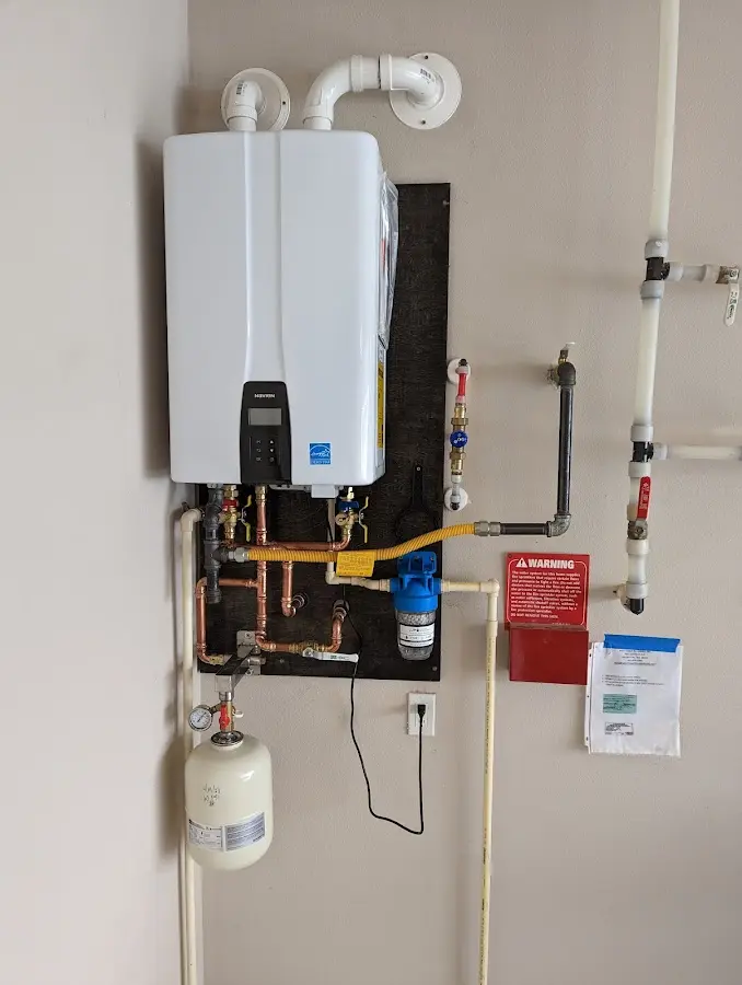 Professional plumber installing copper piping in a Fort Myers Shores home